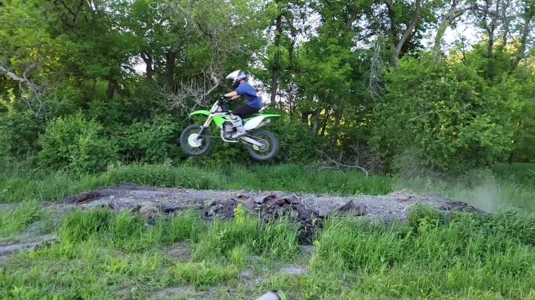 Clay jumping the dirt bike